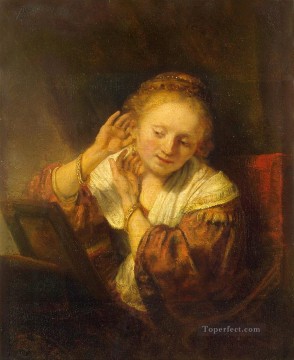Young Woman Trying Earrings Rembrandt Oil Paintings